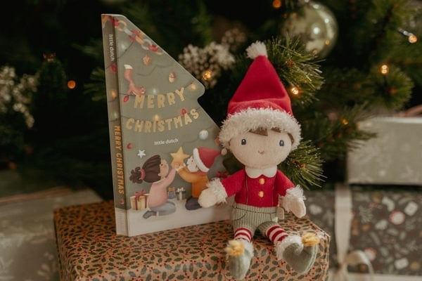 Elfo y cuento de Navidad en caja de regalo